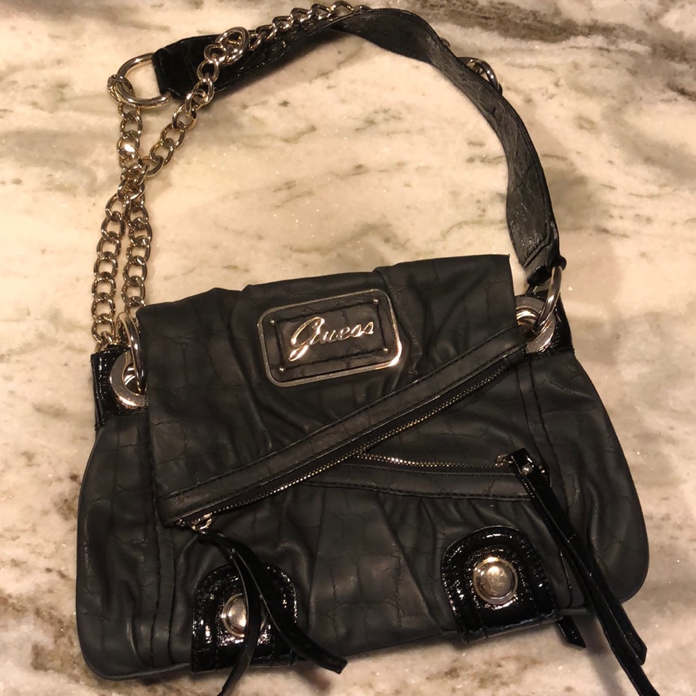 Guess bag with multiple zippers